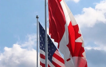 US and Canadian flags drooping