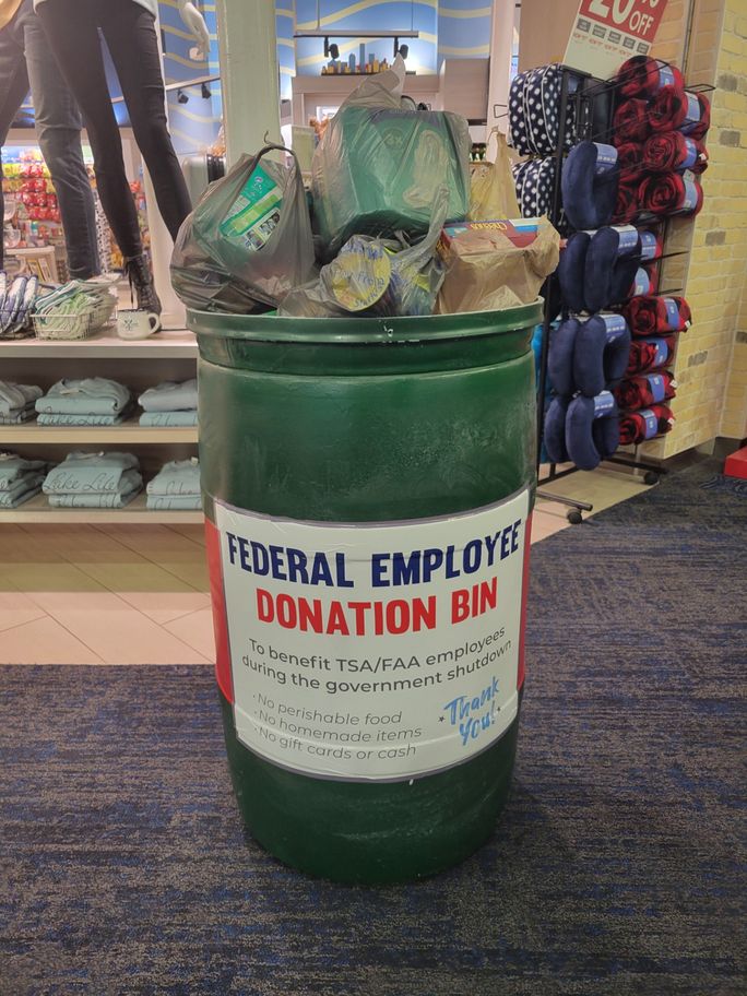 A federal employee donation bin at the airport, where travelers can donate items for TSA and ATC workers. Lacey Pfalz, federal workers, tsa, airports, government shutdown, donation bin, ATC