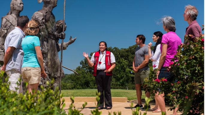 A group tours the Chickasaw Cultural Center with a guide. Chickasaw Country, indigenous tourism, AIANTA members, chickasaw cultural center