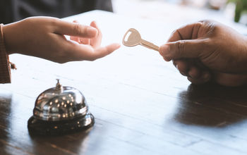 Guest checking in at a hotel front desk.