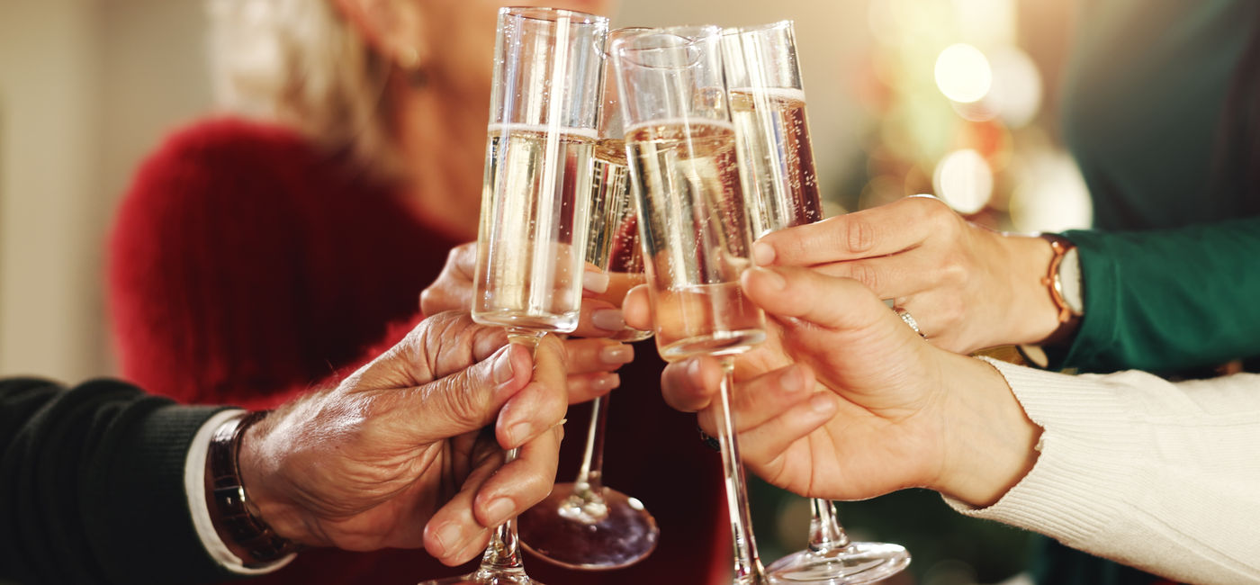 Image: A luxury group toasting with champagne glasses during a celebration. (Photo Credit: Adobe Stock/peopleimages.com)