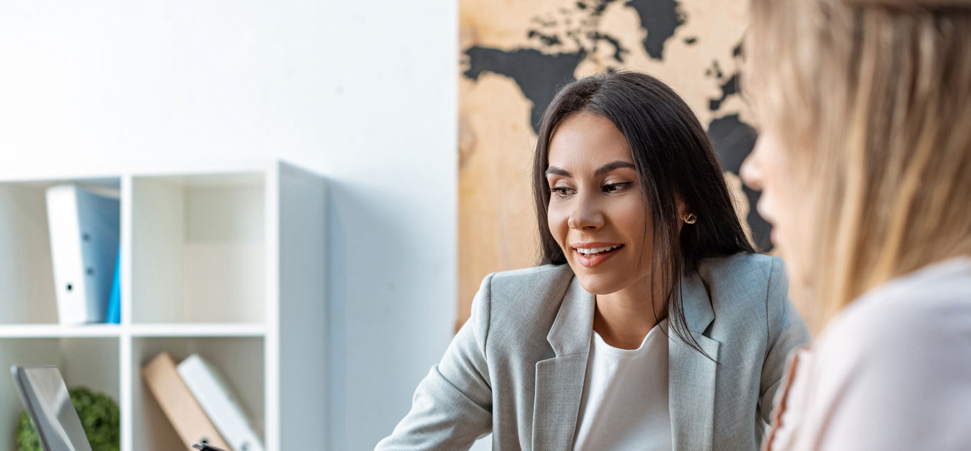 Image: Helping clients understand the ins and outs of their travel arrangements (Photo Credit: Lightfield Studios/Adobe Stock)