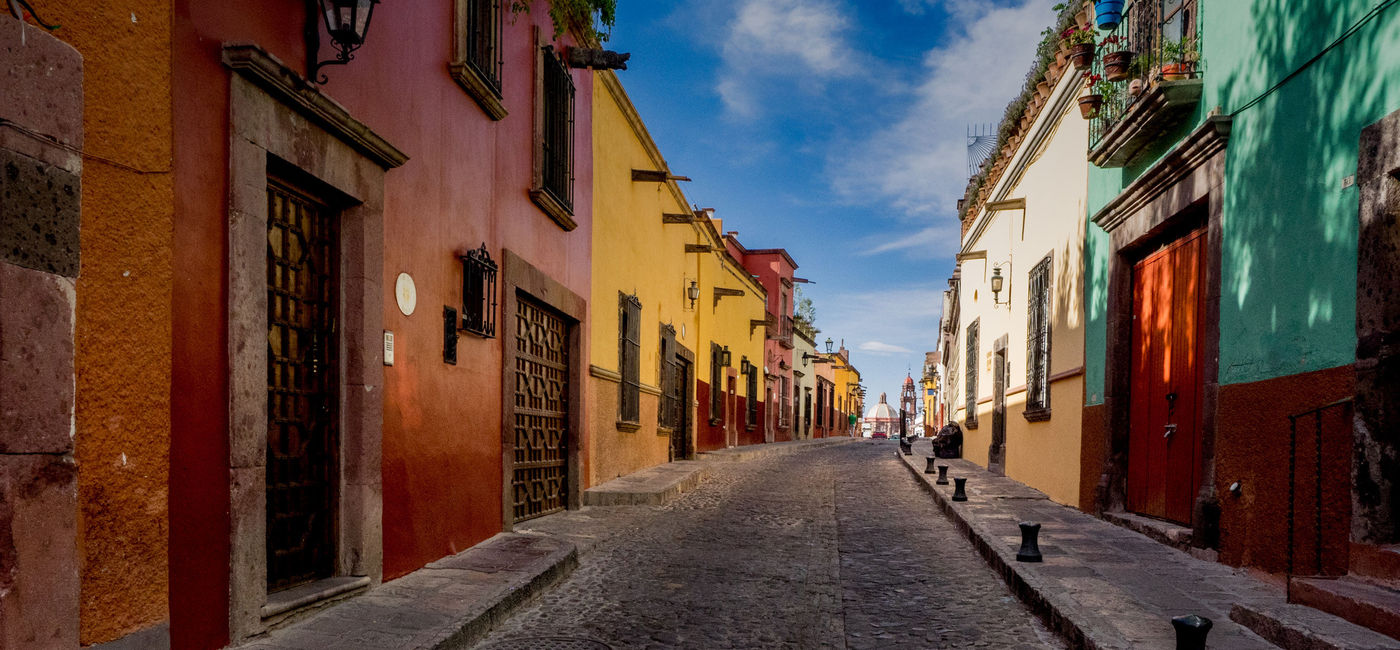 Image: The many backstreets of San Miguel de Allende in Mexico can be quiet, colorful and beautifully preserved. A wonderful serene place for a morning or evening walk. (photo via thupton / iStock / Getty Images Plus)
