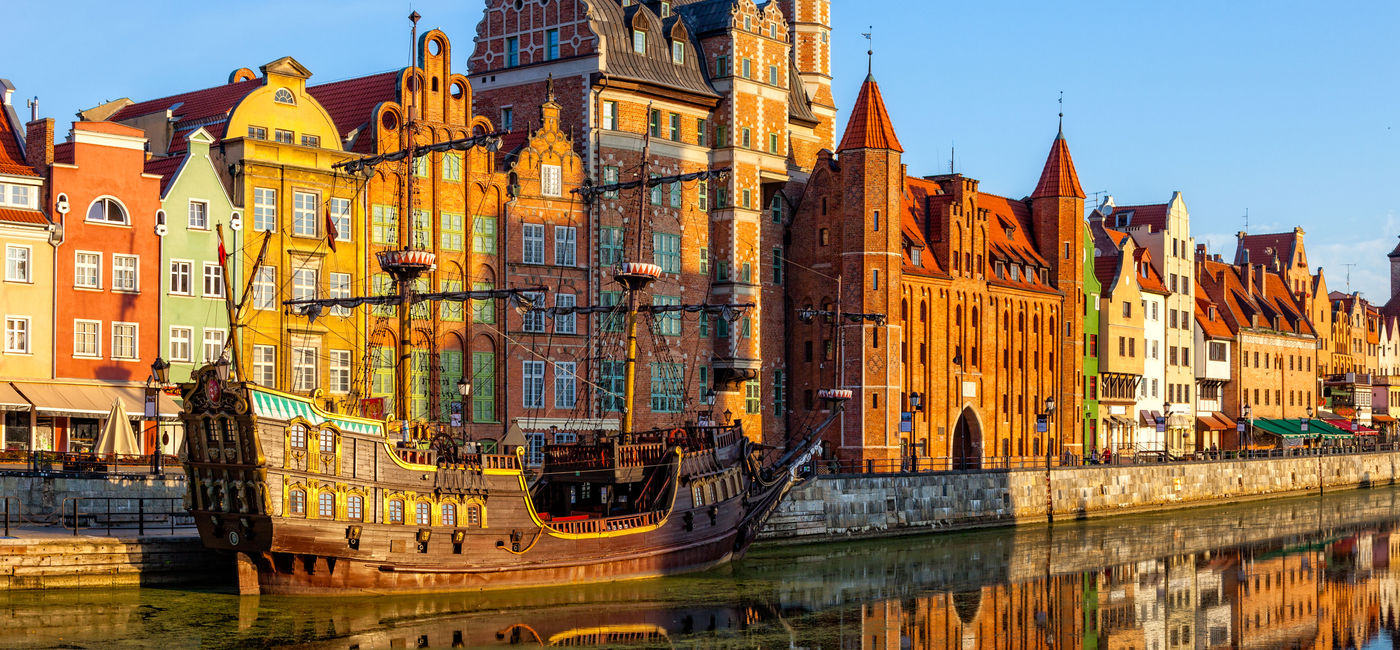 Image: The riverside with the characteristic promenade of Gdansk, Poland. (photo via nightman1965 / iStock / Getty Images Plus)
