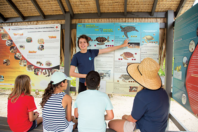 Kids learn about marine life through Paul Gauguin's Moana Explorer Program. Paul Gauguin Cruises, moana explorer program, kid-friendly cruises