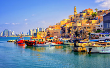 Old town and port of Jaffa and modern skyline of Tel Aviv city, Israel (photo via Xantana / iStock / Getty Images Plus)