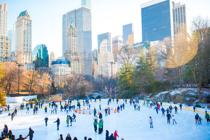 People ice skating in Central Park, New York City People ice skating in Central Park, New York City