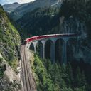Rail Europe train traveling through the mountains