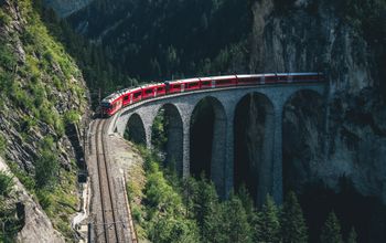 Rail Europe train traveling through the mountains