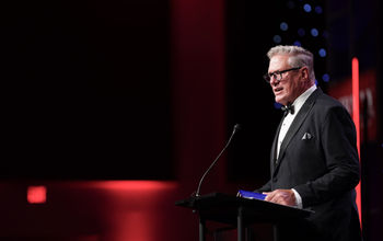 Mike Julius speaks at the 2025 Travvy Awards gala in Fort Lauderdale, Florida