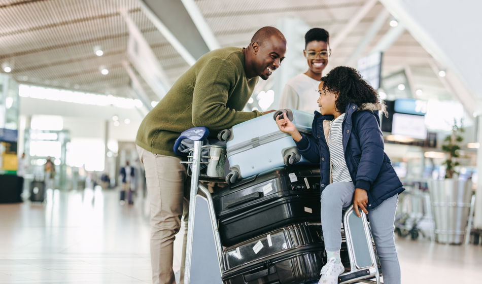 Family preparing for travel at the airport