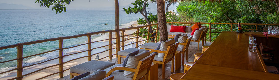 Thatched roof bar above beach